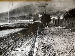 The main road Camps Bay, just in front of the Rotunda. The Flood, 1918.